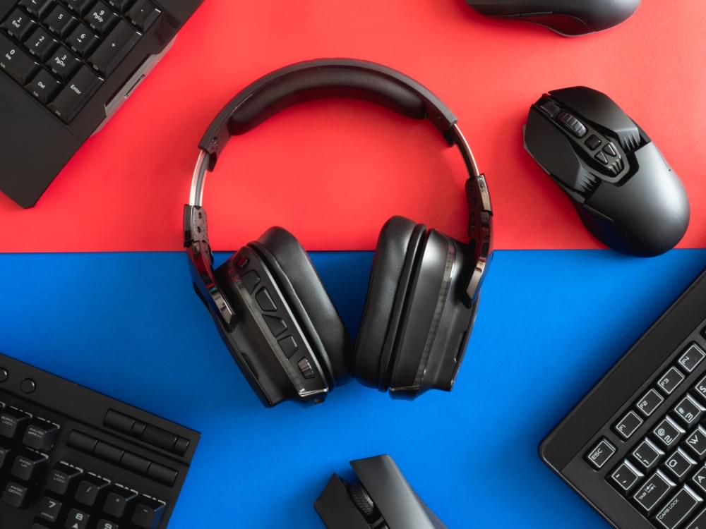 Top-view-a-gaming-gear-mouse-keyboard-headphone-and-mouse-pad-on-table-background-scaled-1.jpg