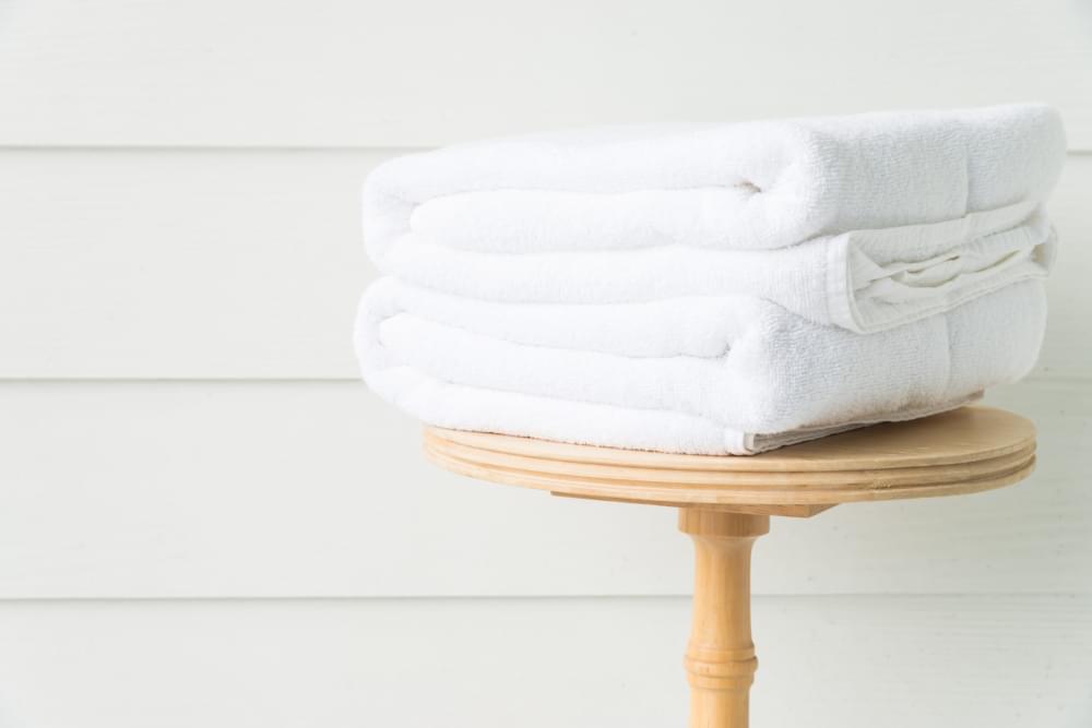 Towel-bath-on-wood-table-scaled-1.jpg