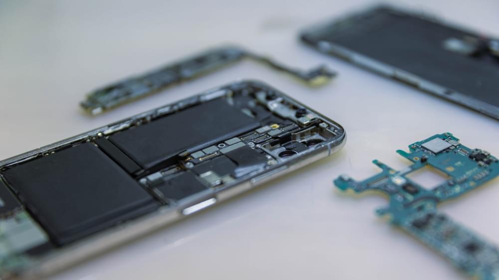Phone-repair-concept-several-electronic-devices-taken-apart-into-the-components-like-the-covers-circuit-boards-bodies-scaled-1.jpg