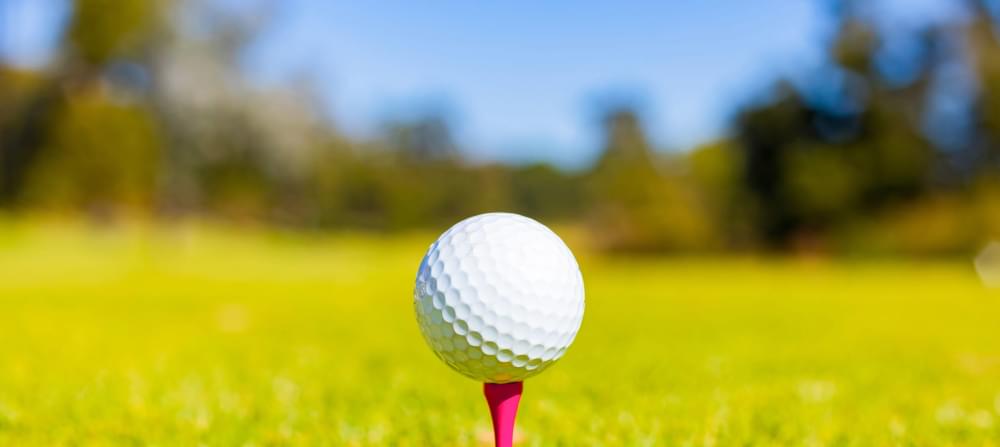 Shallow-focus-golf-ball-tee-course-scaled-1.jpg