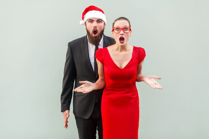 Businessman-and-woman-looking-at-camera-standing-together-open-mouth-with-amazed-face-studio-shot-gray-background-1.jpg