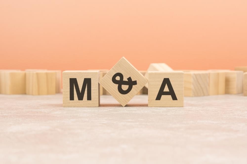 20221106_m-and-a-wooden-blocks-word-on-orange-background-ma-short-for-mergers-and-acquisitions-business-concept-1.jpg