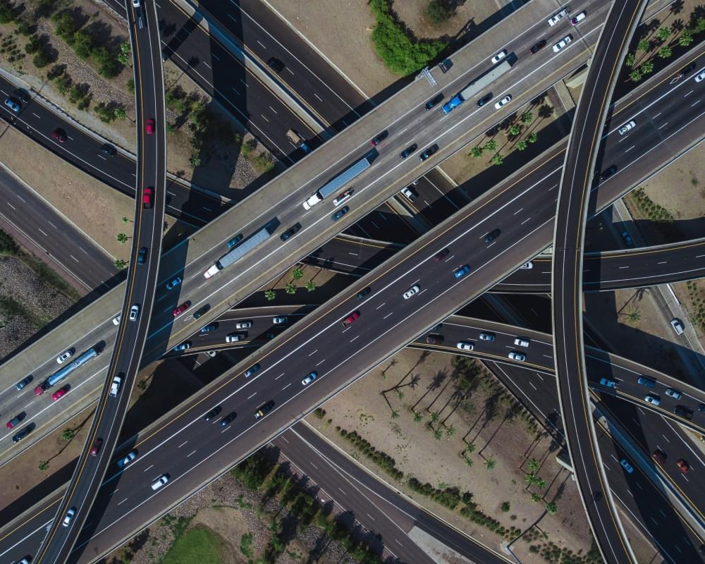 Aerial-view-of-a-busy-highway-intersection-full-of-traffic-during-daytime-scaled-e1690852962872-1.jpg